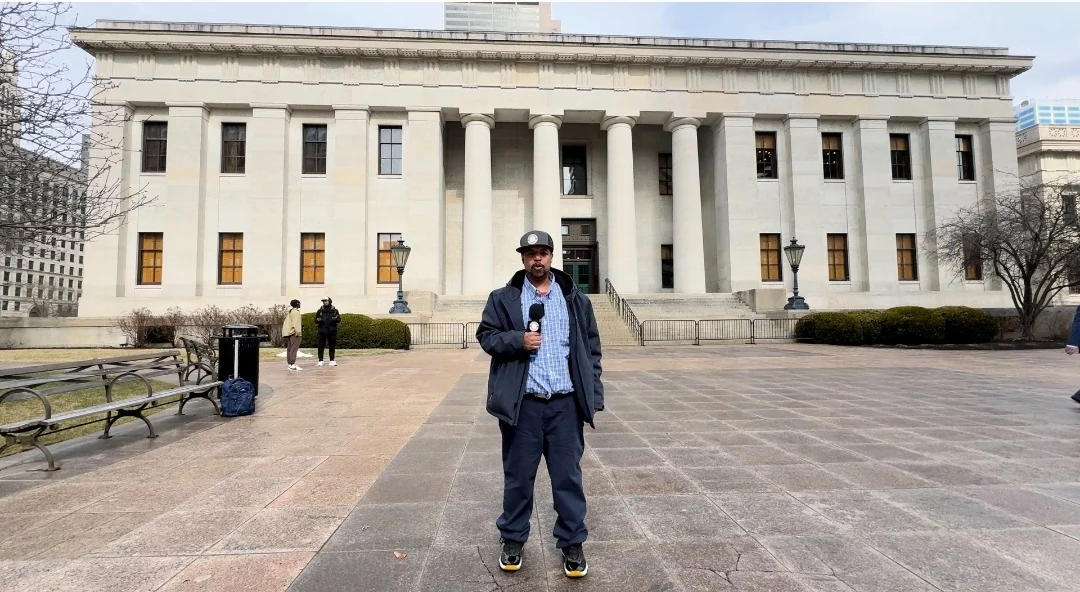 Mastamynd holding an Ohio Cannabis Live microphone outside the Ohio Statehouse in Columbus